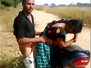 Sizzling Bhabhi experiences thrilling ride on motorcycle, engaging in passionate Andhra Telugu sex, all captured in a tantalizing video.