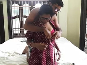 Young and lustful Indian couple indulges in intense and passionate sex, with the man using a dildo to please his wife.